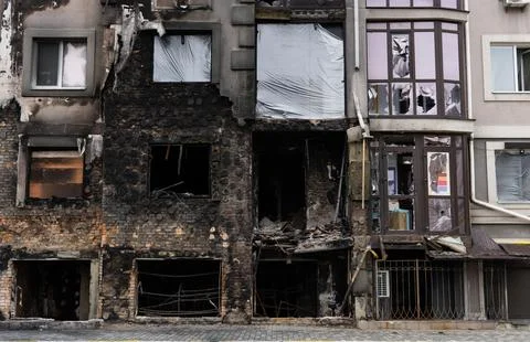 Windows of an apartment building after a fire. Stock Photos
