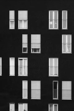 Windows on a black wall Stock Photos