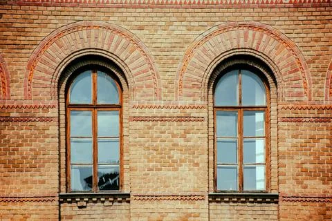 Windows in the brick wall of an old building, ancient architecture Stock Photos