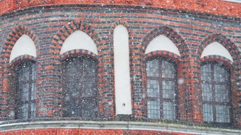 Windows in brick wall, snowy winter day, slow motion Stock Footage 130802009
