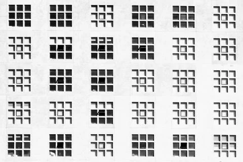 Windows on building facade with square pattern Stock Photos