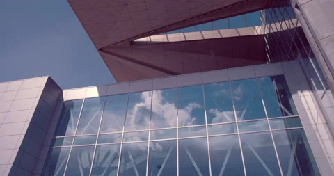 The windows of the building reflect running clouds. Pulkovo Airport. Russia Video stock 119576740