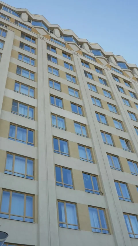 Windows of buildings in closeup view, Home working. Bottom up view of business c Stock Footage 289080439