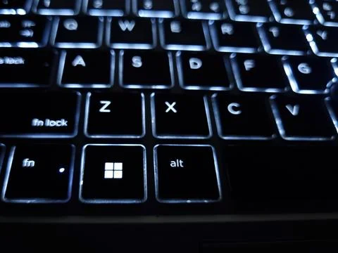 Windows button with backlit lighting keyboard in night Stock Photos