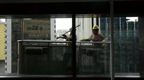 Windows cleaners in a skyscraper Stock Footage 11230885