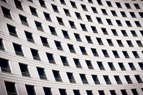 Windows on a curved building Stock Photos