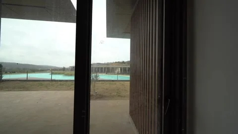 Window's Edge: Poolside Panorama Awaits Stock Footage 305757702