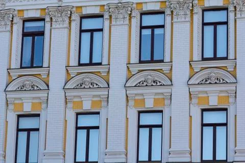 Windows of the facade of the building in the classical style. Architecture Stock Photos
