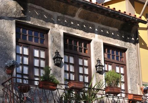Windows on a front wall of a balcony Stock Photos