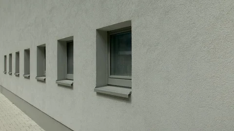 Windows at grey exterior wall Stock Footage 82448714