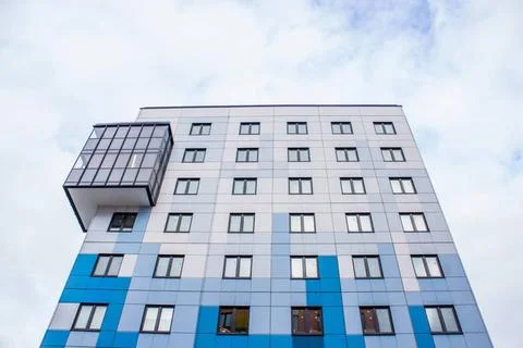 Windows of a high multi-storey building. House. windows of a new house win... Stock Photos
