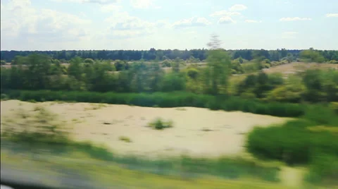 From the windows of high-speed trains on the fields and lakes (POV) Stock Footage 27290899