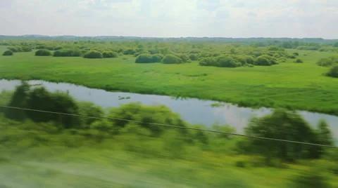 From the windows of high-speed trains on the fields and lakes (POV) Stock Footage 27291053