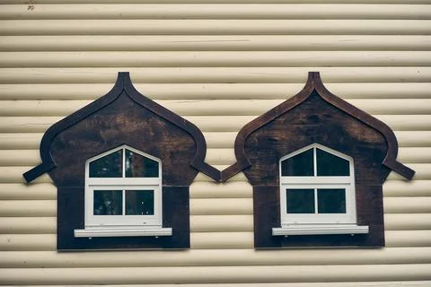 Windows in the house. The facade of the building has a white wall of rounded Stock Photos