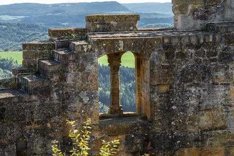 Windows inside of the massive high walls of an old medieval castle Stock Photos