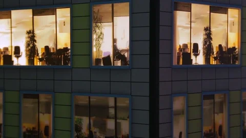 Windows light up in the house. Fragment of the layout of the building Video stock 71294579