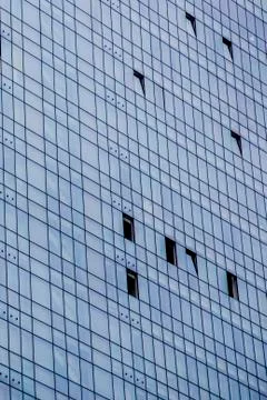 Windows of modern office building texture seen from below Stock Photos