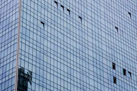 Windows of modern office building texture seen from below Stock Photos