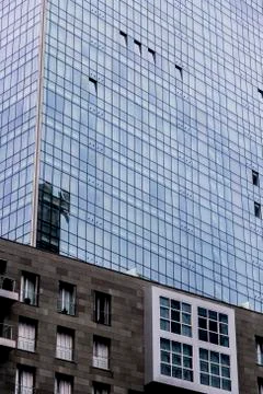 Windows of modern office building texture seen from below Stock Photos