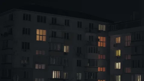 Windows of a multi-apartment building, in some the light shines at night Stock Footage 128283306