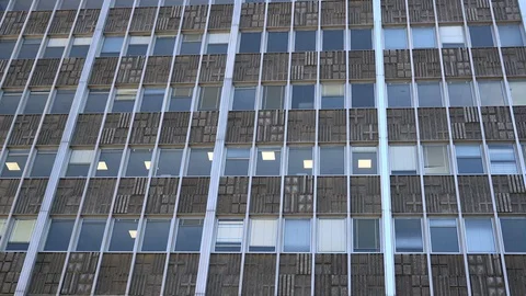 Windows of an office building during a working day Stock Footage 114084978