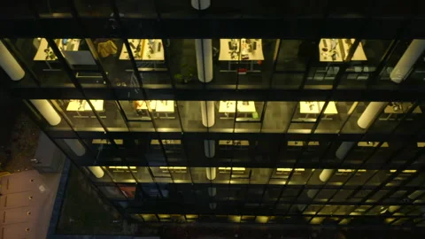 Windows of offices in a skyscraper building at night aerial view. Stock Footage 226974408