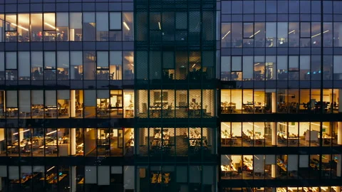 The windows of the offices of the skyscraper at night view from the drone. Stock Footage 229060797