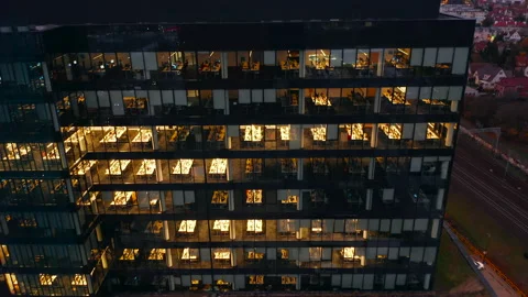 The windows of the offices of the skyscraper at night view from the drone. Stock Footage 229061634