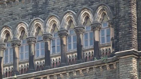Windows of an old gothic structure of the victorian era. Stock Photos