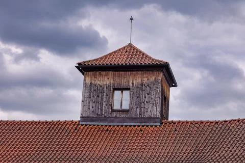 Windows of an old historic building on the backdrop of cloudy sky Fotos de archivo
