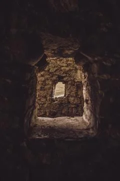 Windows in an old stone building. Windows in the castle, loopholes Stock Photos