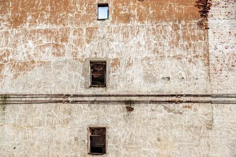 Windows on the old wall. Stock Photos