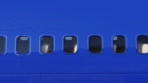Windows of a passing plane. close up on the windows of an airplane. blue plane Stock Footage 264338553