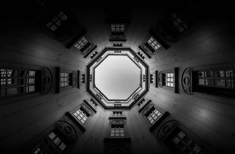 Windows in perspective with sky in background Italy, Milan. Interior of an... Stock Photos