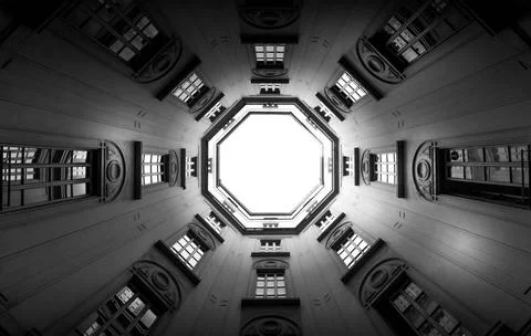Windows in perspective with sky in background Italy, Milan. Interior of an... Stock Photos