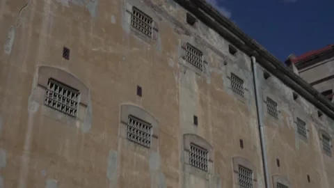 Windows of prison cells with metal bars, view from the street. Stock Footage 150124854