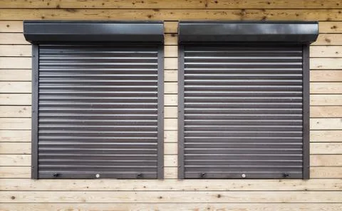 Windows protected with roller shutters Stock Photos