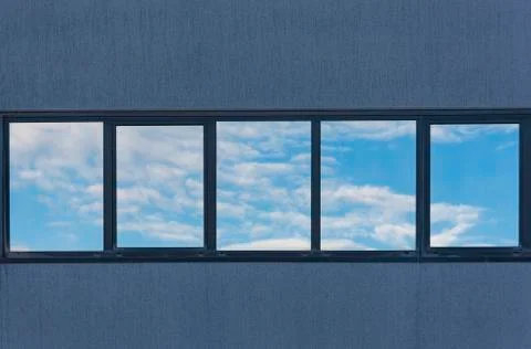 Windows with reflections in a building Stock Photos