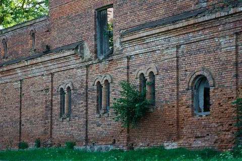 The windows of a ruined brick stable. 19th century buildings Stock Photos