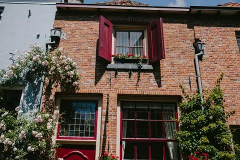 Windows with shutters on the old building Stock Photos