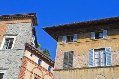 Windows with shutters, Siena. Stock Photos