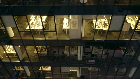 Windows skyscraper building late night with glowing and flashing interior lights Stock Footage 255410213