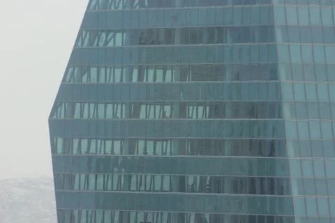 Windows of a skyscraper, people working inside, Istanbul Фото