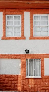 Windows Symmetrical Front View Orange White Simple Home Exterior 库存照片