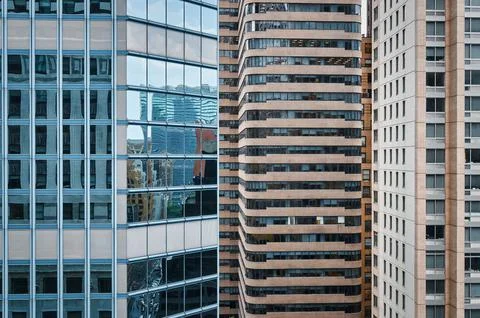 Windows of three big buildings Stock Photos
