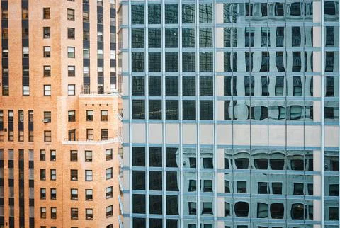 Windows of two big buildings Stock Photos
