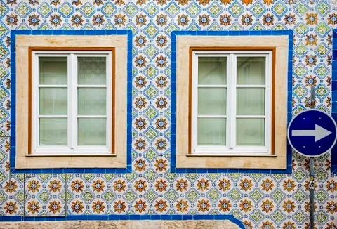 Windows on a wall lined with ceramic tiles in Lisbon, Portugal Stock Photos
