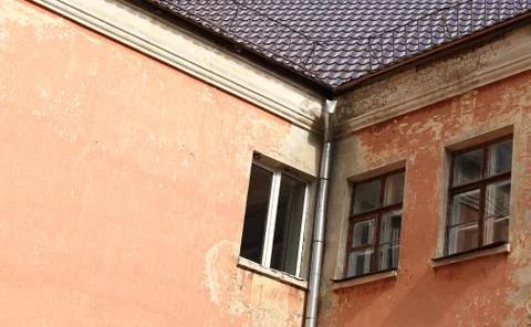 Windows on the wall of an old house Stock Photos