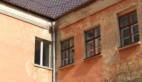 Windows on the wall of an old house Stock Photos