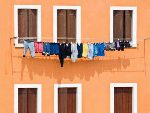 Windows with washing hung on drying Stock Photos